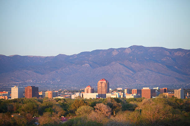Albuquerque Downtown Albuquerque skyline at dusk. Albuquerque is the largest city in the state of New Mexico, United States. Albuquerque is known for its pleasant scenery, southwestern cuisine and International Balloon Fiesta.  bernalillo county stock pictures, royalty-free photos & images