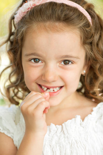 istock Little Girl Removing Tooth 171277690