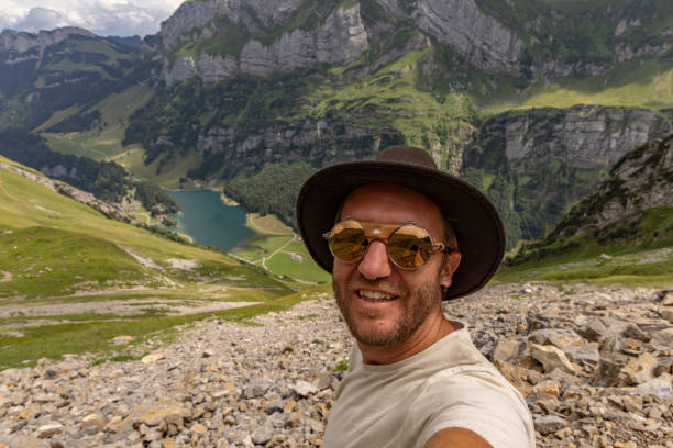istock Man on a hike takes a selfie 1712777254
