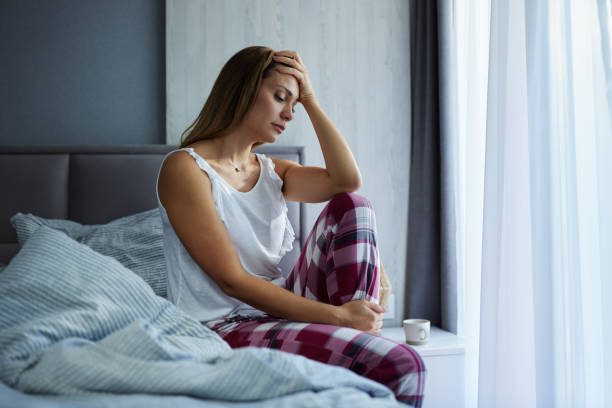istock Young worried woman having problems during morning in a bed. 1712781501