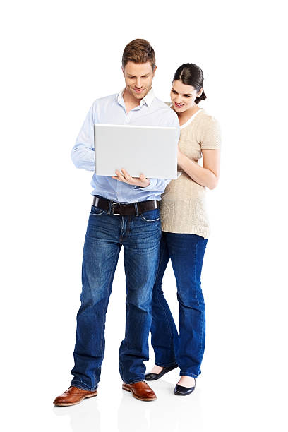 istock Attractive young couple using laptop on white 171278394