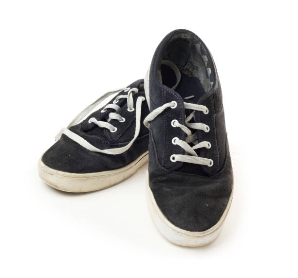 istock Old dirty worn out deck shoes on a white background 171278593