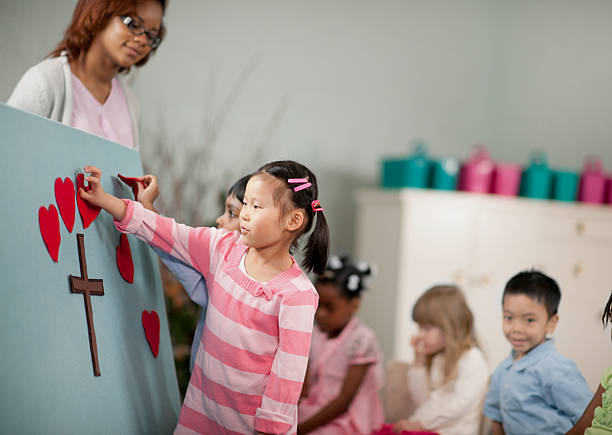 Children's religious program Children in Sunday School sunday school church stock pictures, royalty-free photos & images
