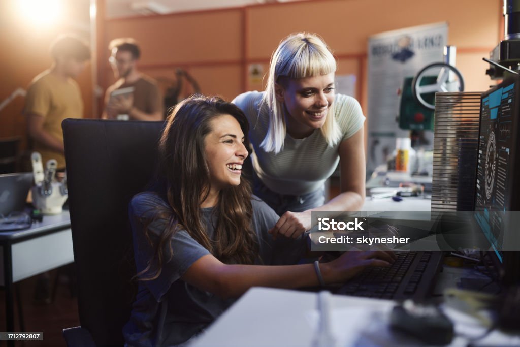 Happy Female Programmers Working On Desktop Pc In Robotics Lab Stock ...