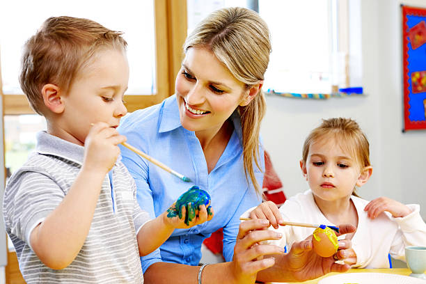 istock Little preschoolers with teacher in art class 171279306