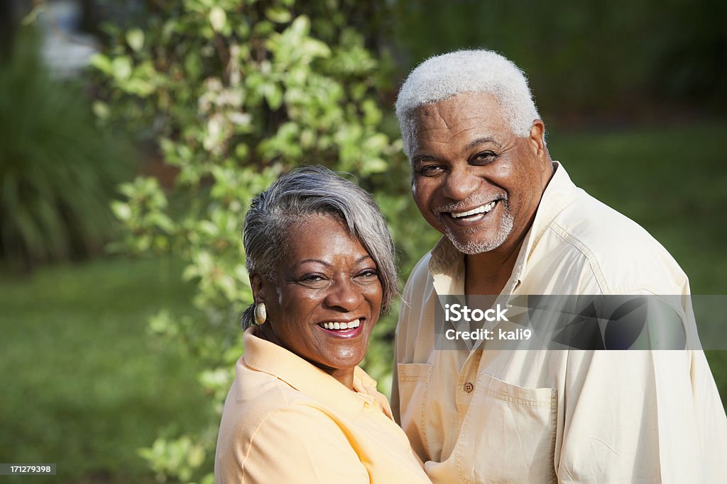 Happy senior African American couple Portrait of affectionate African American senior couple smiling. African Ethnicity Stock Photo