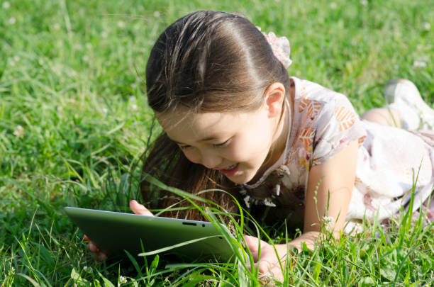 istock Girl play with digital tablet 171279719