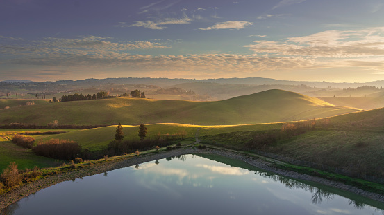 Lake and rolling hills. Via Francigena landscape. Castelfiorentino, Firenze, Tuscany, Italy