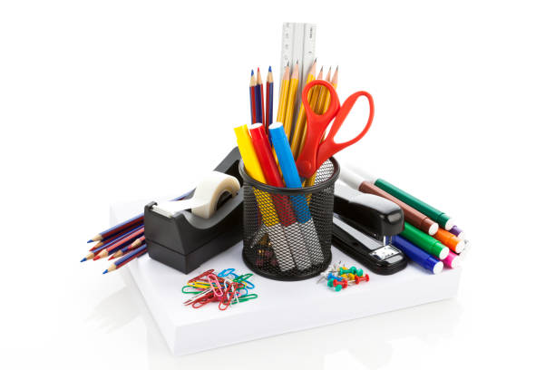 Office or School Supplies Office or School Supplies on White Background stapled paper stock pictures, royalty-free photos & images