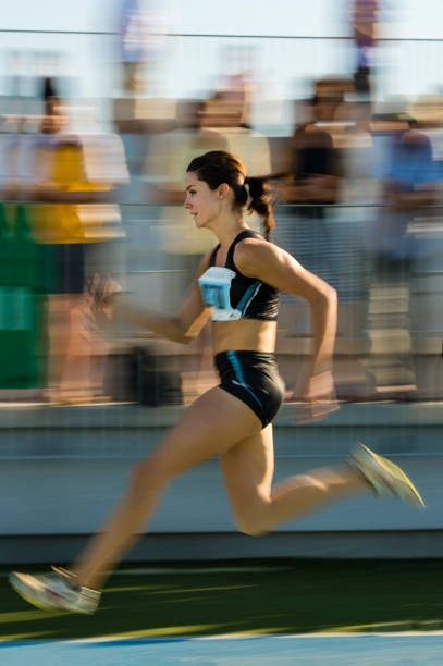 istock Young attractive female athlete at 100 m sprint 171280351