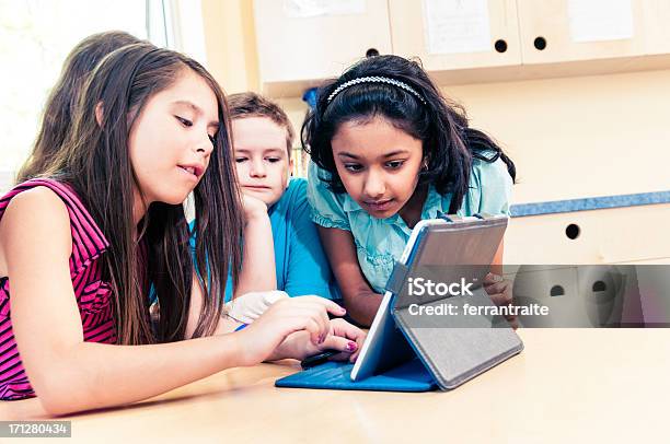 School Children Using Tablet Pc Stock Photo - Download Image Now - Classroom, Digital Tablet, Education