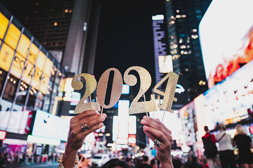 People hold the number 2024, celebration conceptual image for New Year’s Eve.