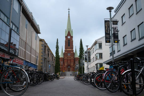 Mikkeli Cathedral seen from the street with bicycles parked on both sides. Mikkeli Cathedral seen from the street with bicycles parked on both sides. Mikkeli, Finland. September 11, 2023. etela savo finland stock pictures, royalty-free photos & images