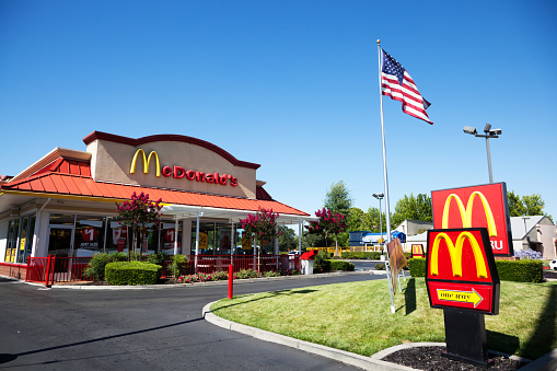 McDonald's logo, fastfood restaurant chain in building of South Station, American corporation food service industry,travel fast food, Frankfurt, Germany - August 10, 2023