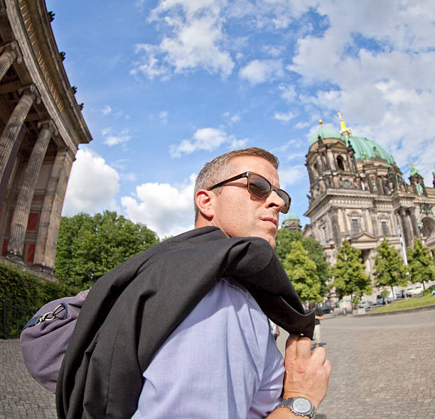 istock Man in Berlin Lustgarten museum cathedral 171281526