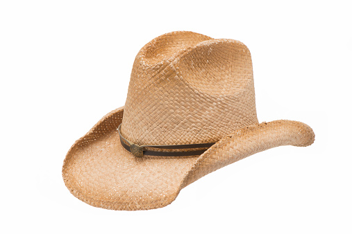 Viejo oeste de paja sombrero de vaquero-Aislado en blanco photo