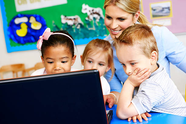 istock Cute little preschoolers learning computer at kindergarten 171282036