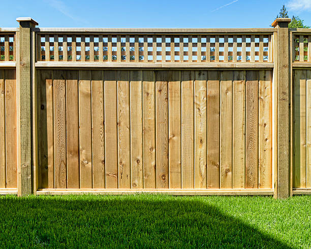 Fence panel placed in a yard for safety stock photo