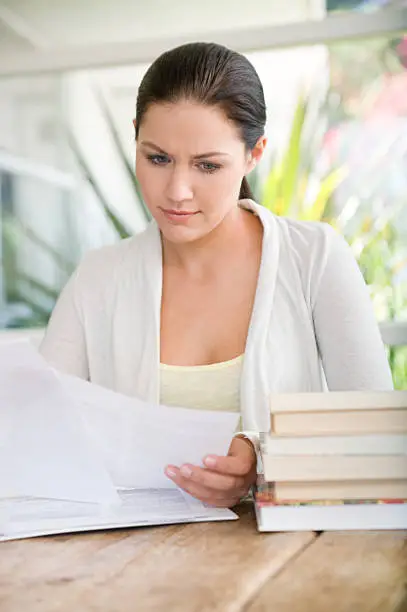 A woman reading papers