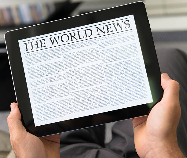 istock Man reading the newspaper on contemporary digital tablet at home 171282824
