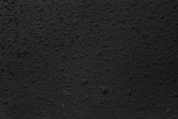 rough black paint drops background macro photo