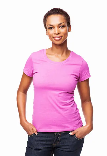 Portrait of a casual African American woman smiling with hands in pockets. Vertical shot. Isolated on white.