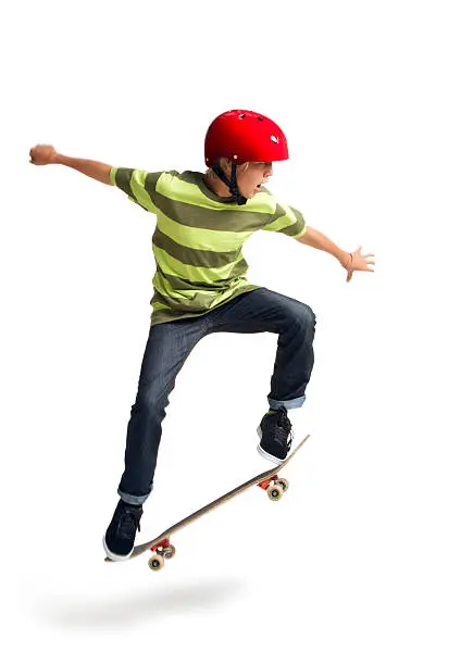 This is a photo of a 14 year old boy performing an ollie on a skateboard taken in the studio on a white background.Click on the links below to view lightboxes.