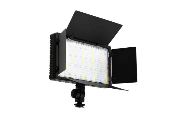 istock Photo and video lamp isolate on white background. LED lamp with special shutters for the formation of light flux. Photo and video lighting fixture. 1712837851