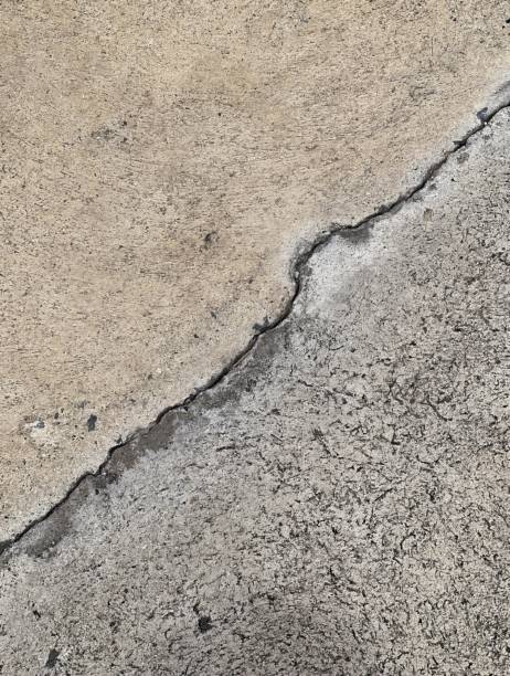 istock a cracked concrete floor with a crack in it.. 1712847146