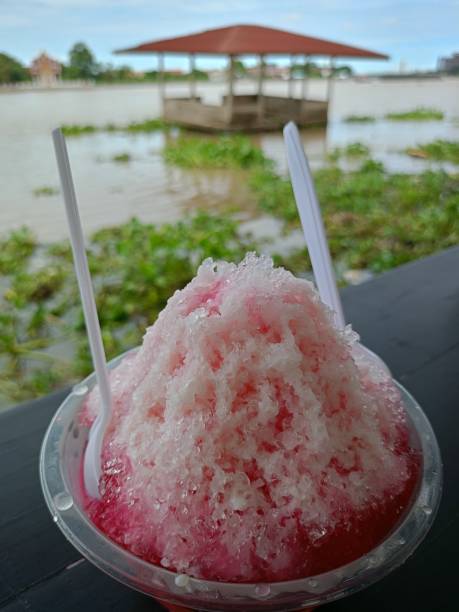 istock Shaved ice with pink milk in a cup 1712848078