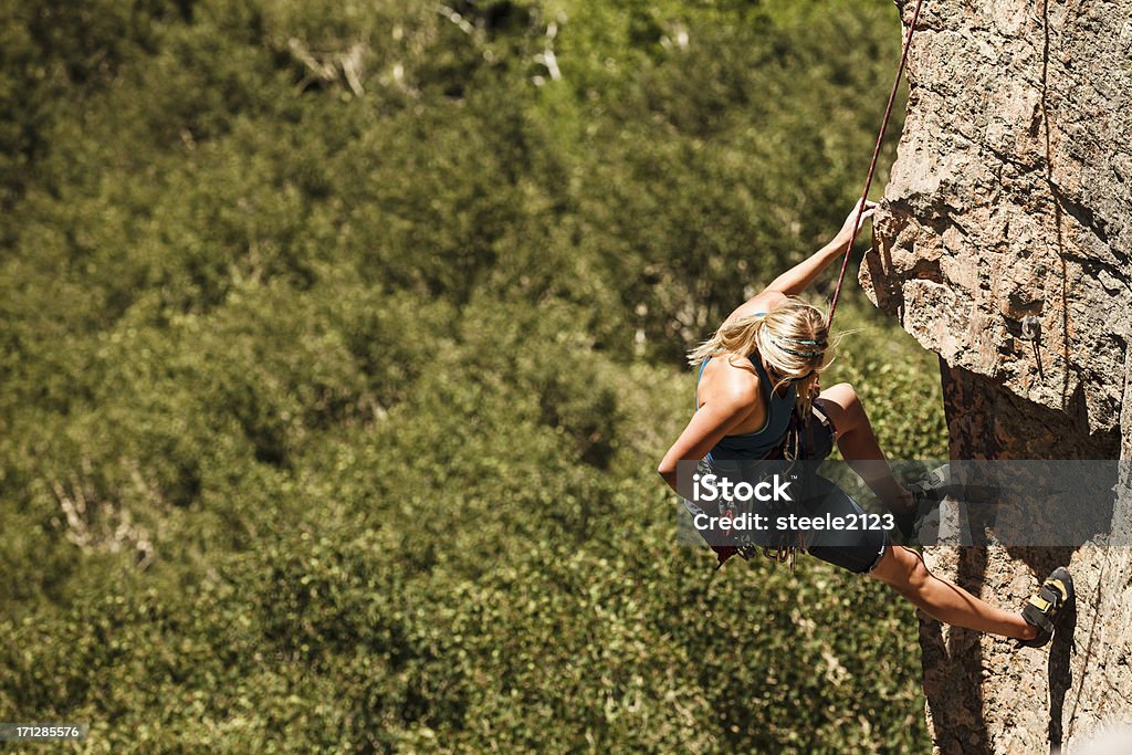 Rock Climbing A female mountain climber reaching into her chalk bag. Colorado Stock Photo