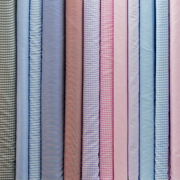 istock Rolls of multi-coloured cotton shirt textiles. 171285732