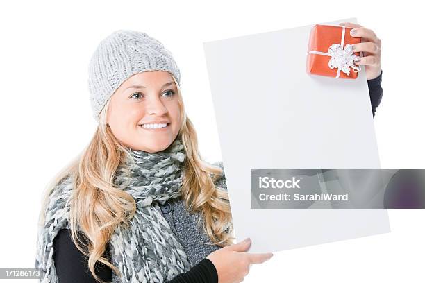 Attractive Female Looking Away With Gift And Empty Sign Board Stock Photo - Download Image Now
