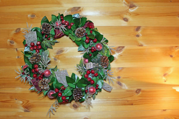 istock Christmas wreaths on a log house 1712868361
