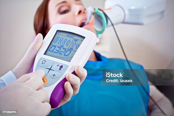 Dentist Taking Xrays Of Patient Stock Photo - Download Image Now - 30-34 Years, Adult, Adults Only