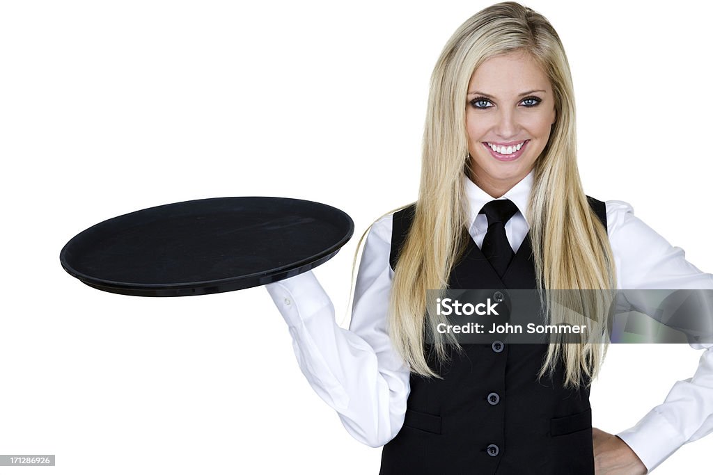 Waitress holding a serving tray Smiling waitress holding a serving tray and wearing a black tie and vest Sensuality Stock Photo