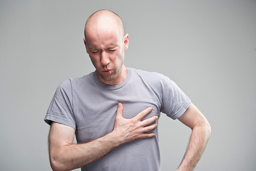 A man having a heart attack or a severe angina pectoris. XXL size image. iStockalypse, Berlin 2012.
