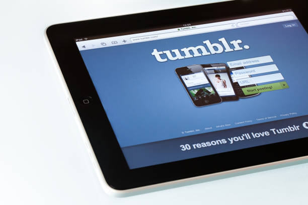 Tumblr page on  Apple iPad2 "Montevideo, Uruguay - March 15, 2012: Highangle view of an Apple iPad2 displaying Tumblr homepage on a desk. Tumblr is a microblogging platform and social networking website, owned and operated by Tumblr, Inc. iPad, the digital tablet with multi touch screen produced by Apple Computer, Inc." microblogging stock pictures, royalty-free photos & images