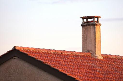 Old chimney on a house in France, selective focus