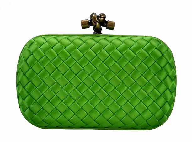 Photo of A green clutch handbag isolated on white
