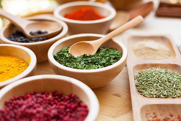 Various spices in wooden bowl