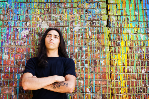 Young man daydreaming against a colorful backdrop. More of this series...