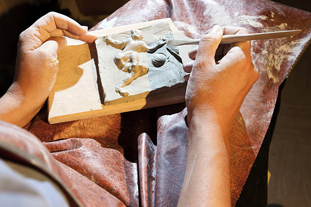istock Female potter making a clay football player 171289160
