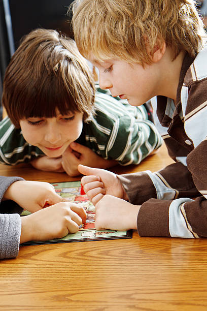 istock Family Playing A Board Game Together 171289235