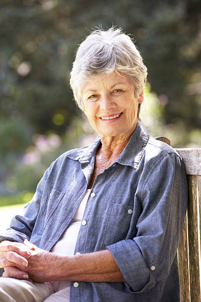 istock Senior Woman Relaxing On Park Bench 171289239