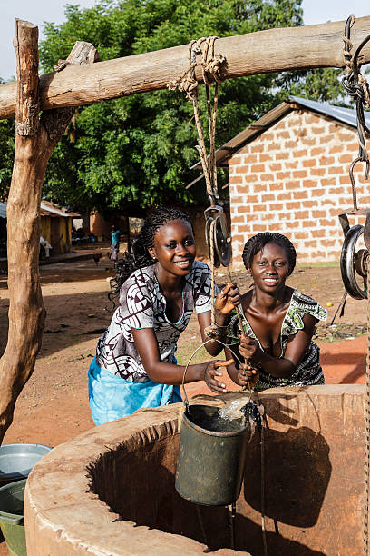 istock Two African girls drawing water from a well 171289630