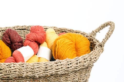 A Basket of brightly colored yarn.