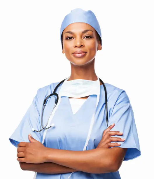 Portrait of a confident African American female surgeon standing with hands folded. Horizontal shot. Isolated on white.