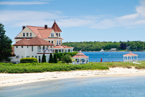 A tiled roof inn on a point of land on Onset Bay on upper Cape Cod offers a bit of old time elegance and relaxation,