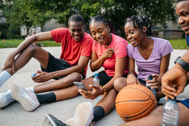 istock Young Black Family Using Phone After A Basketball Game 1712904308